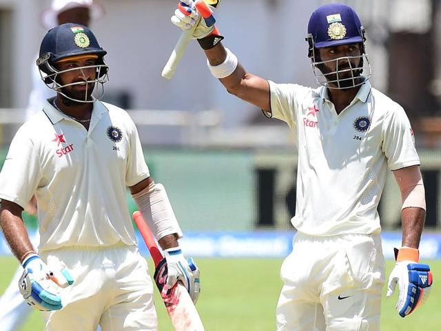 Lokesh Rahul of India raises his bat celebrating his century against West Indies. (AFP Photo) Lokesh Rahul of India raises his bat celebrating his century against West Indies. (AFP Photo)
