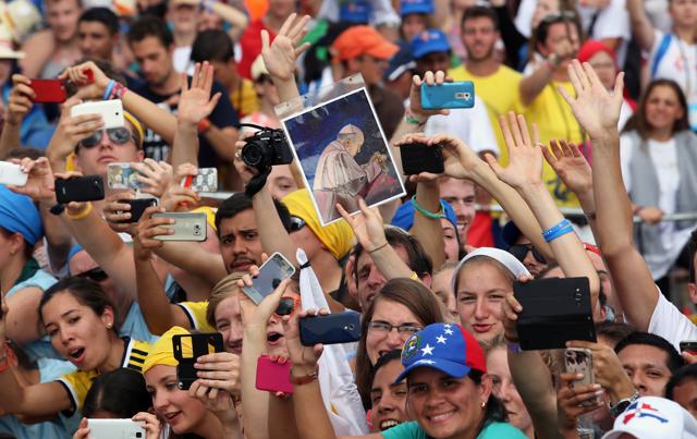 People greet Pope Francis as he arrives for the World Youth Day. (REUTERS) People greet Pope Francis as he arrives for the World Youth Day. (REUTERS)