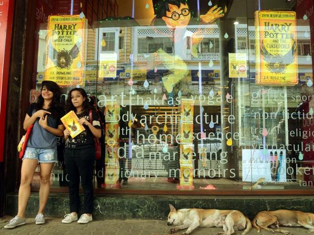 Fans pose with their newly bought copy of Harry Potter and The Cursed Child. (Prateek Choudhury/HT Photo)