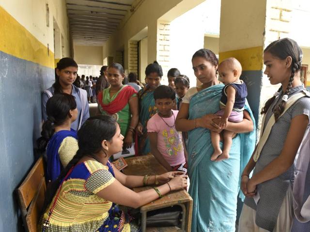 Parents and teachers interact at a school in Sonia Vihar on Saturday.(Sushil Kumar/ Hindustan Times)