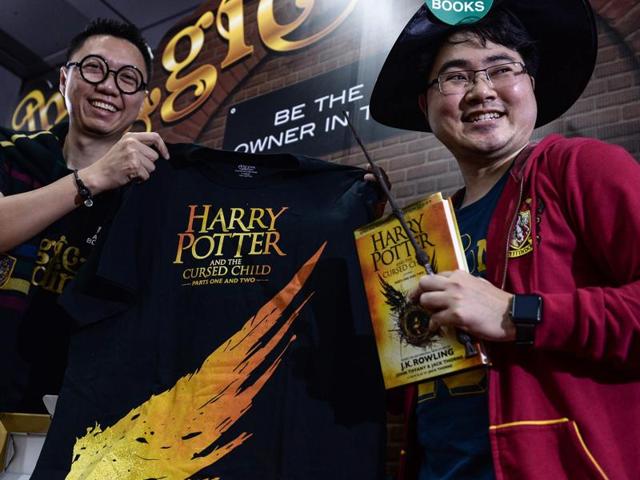 Potter fan Santipat Huangsawat (right) with the first of the new Harry Potter script book that was launched in Thailand on Sunday. (AFP) Potter fan Santipat Huangsawat (right) with the first of the new Harry Potter script book that was launched in Thailand on Sunday. (AFP)