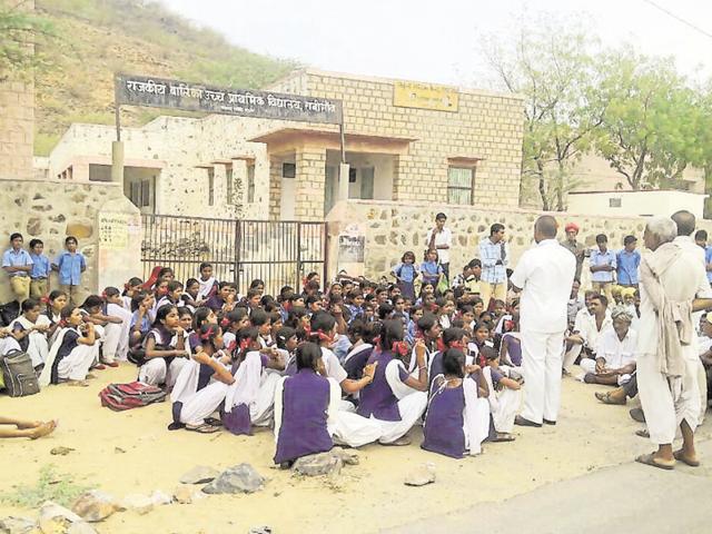 Girl students protest the proposed merger of their school with a boys’ school, in Ranigaon on Monday.(HT Photo)