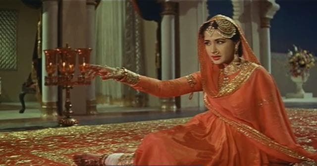 Meena Kumari played a courtesan in Pakeezah, opposite Ashok Kumar and Rajkummar, one of her best movies.