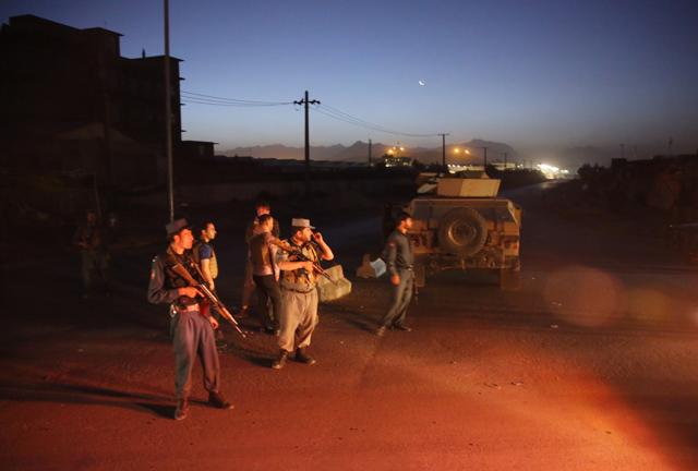 Afghan police black a road leading to the site of an explosion in Kabul on Monday. (AP) Afghan police black a road leading to the site of an explosion in Kabul on Monday. (AP)