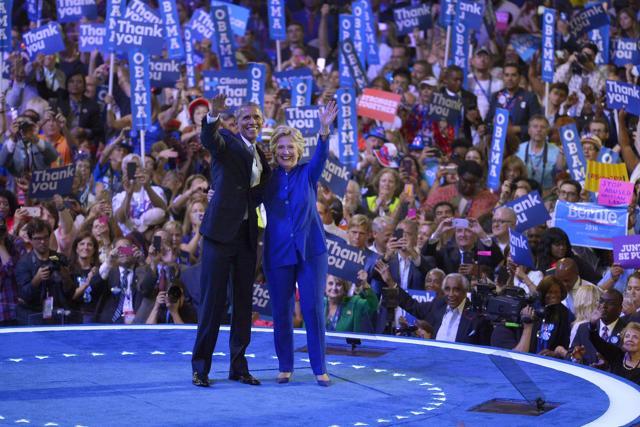 President Barack Obama and Hillary Clinton waves to delegates at the conclusion of President Obama's speech during the third day of the Democratic National Convention in Philadelphia on July 28, 2016. (AP) President Barack Obama and Hillary Clinton waves to delegates at the conclusion of President Obama's speech during the third day of the Democratic National Convention in Philadelphia on July 28, 2016. (AP)
