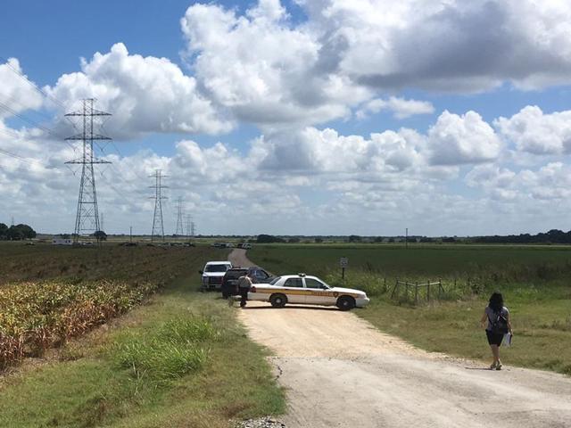 Investigators surround the scene in a field near Lockhart, Texas where a hot air balloon carrying at least 16 people collided with power lines on Saturday. (AP) Investigators surround the scene in a field near Lockhart, Texas where a hot air balloon carrying at least 16 people collided with power lines on Saturday. (AP)