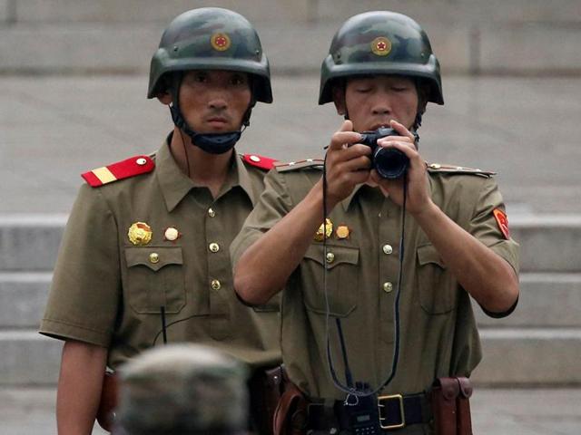 North Korean soldiers peep into a conference room during a ceremony marking the 63rd anniversary of the signing of the Korean War ceasefire armistice agreement at the truce village of Panmunjom, South Korea. Seoul prosecutors believe North Korea hacked into the email accounts of dozens of South Korean government officials this year. (AP Photo) North Korean soldiers peep into a conference room during a ceremony marking the 63rd anniversary of the signing of the Korean War ceasefire armistice agreement at the truce village of Panmunjom, South Korea. Seoul prosecutors believe North Korea hacked into the email accounts of dozens of South Korean government officials this year. (AP Photo)