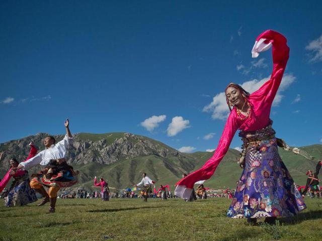 In this picture taken on July 25, 2016, ethnic Tibetans wearing traditional costumes dance at a local government sponsored festival in Yushu, in the northwestern Chinese province of Qinghai. (AFP) In this picture taken on July 25, 2016, ethnic Tibetans wearing traditional costumes dance at a local government sponsored festival in Yushu, in the northwestern Chinese province of Qinghai. (AFP)