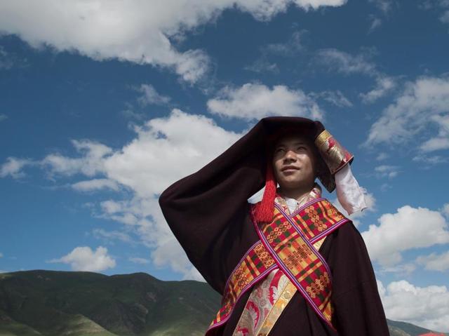 A Tibetan wearing a traditional costume waits to perform at the event. (AFP) A Tibetan wearing a traditional costume waits to perform at the event. (AFP)