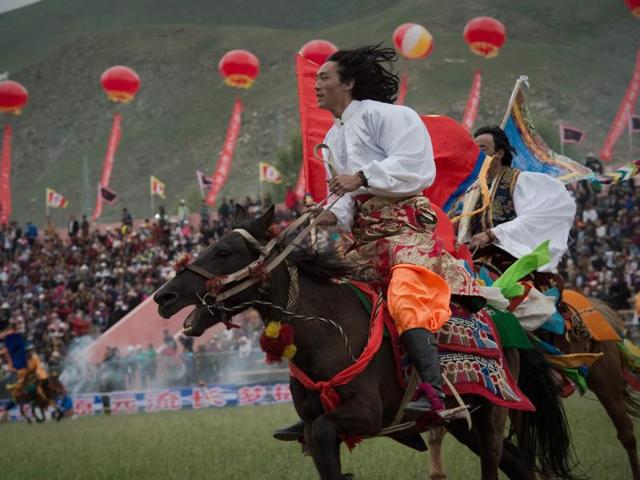 Its spectacular horse festival is held every year on July 25 and sees the participation of around 10,000 people.Tibetans ride horses in traditional dress, showing their horsemanship skills, including archery on horseback and racing. (AFP) Its spectacular horse festival is held every year on July 25 and sees the participation of around 10,000 people.Tibetans ride horses in traditional dress, showing their horsemanship skills, including archery on horseback and racing. (AFP)
