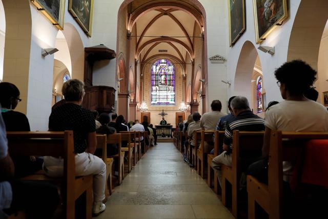 People attend a mass in tribute to priest Jacques Hamel at the Saint-Leu – Saint-Gilles Bagnolet's Church, near Paris, on Sunday. (AFP) People attend a mass in tribute to priest Jacques Hamel at the Saint-Leu – Saint-Gilles Bagnolet's Church, near Paris, on Sunday. (AFP)