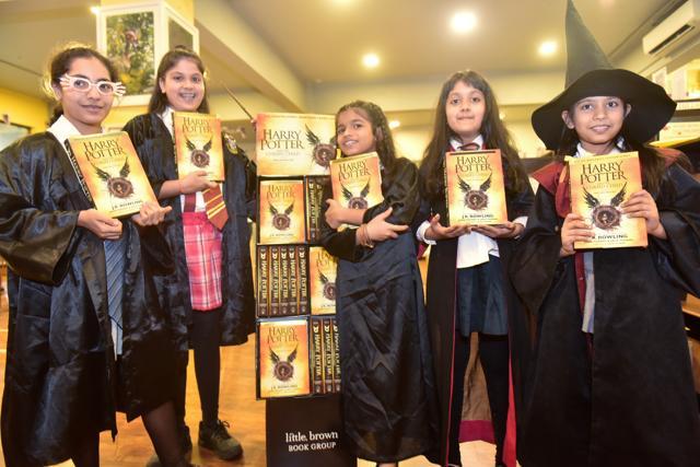 Harry Potter fans with a copy of new book at theTrilogy Library, Lower Parel, in Mumbai, on Sunday. (Vidya Subramanian/HT photo)