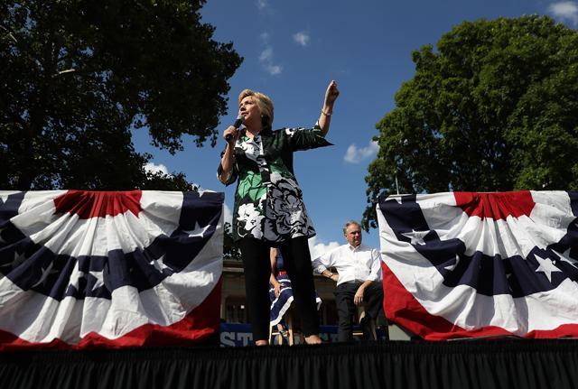Democratic presidential nominee former Secretary of State Hillary Clinton speaks during a campaign rally with democratic vice presidential nominee US Sen Tim Kaine (D-VA) at Fort Hayes Vocational School in Columbus, Ohio. (AFP) Democratic presidential nominee former Secretary of State Hillary Clinton speaks during a campaign rally with democratic vice presidential nominee US Sen Tim Kaine (D-VA) at Fort Hayes Vocational School in Columbus, Ohio. (AFP)