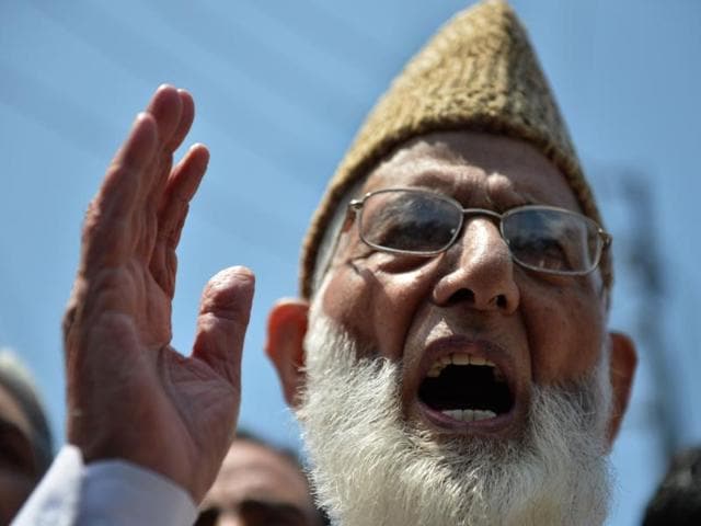 Senior separatist leader of the hardliner faction of All Parties Hurriyat Conference (APHC) Syed Ali Shah Geelani, center, with supporters outside his house in Srinagar. (AP File Photo) Senior separatist leader of the hardliner faction of All Parties Hurriyat Conference (APHC) Syed Ali Shah Geelani, center, with supporters outside his house in Srinagar. (AP File Photo)