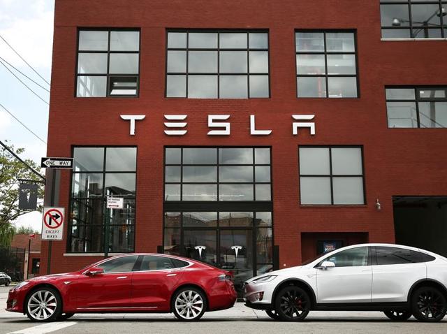 In this file photo, Tesla vehicles can be seen parked outside of a new company showroom and service centre in Red Hook. (AFP) In this file photo, Tesla vehicles can be seen parked outside of a new company showroom and service centre in Red Hook. (AFP)