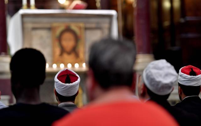 Muslims take part in a mass at the Church Santa Maria in Trastevere in Rome on Sunday. (AFP) Muslims take part in a mass at the Church Santa Maria in Trastevere in Rome on Sunday. (AFP)