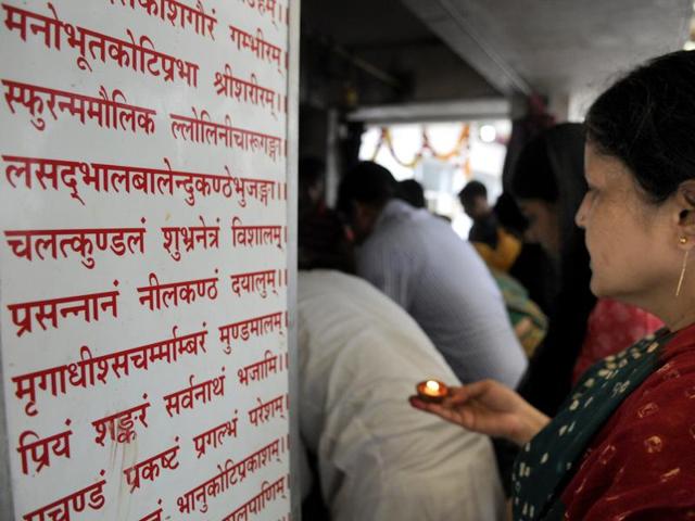 Devotees offer prayers at a temple in Noida. (Sunil Ghosh/HT Photo) Devotees offer prayers at a temple in Noida. (Sunil Ghosh/HT Photo)