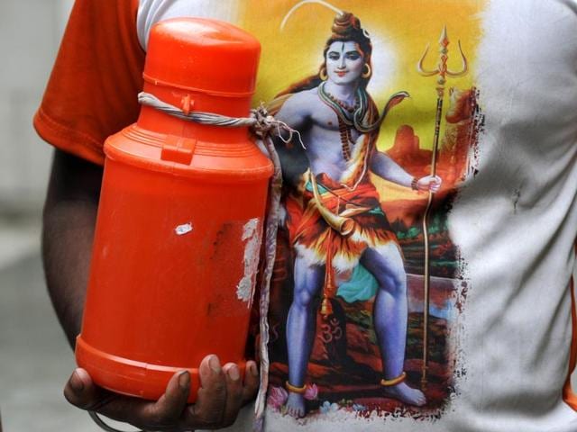 A Kanwariya can be seen with holy water collected from Ganges in Haridwar. (Sunil Ghosh/HT Photo) A Kanwariya can be seen with holy water collected from Ganges in Haridwar. (Sunil Ghosh/HT Photo)