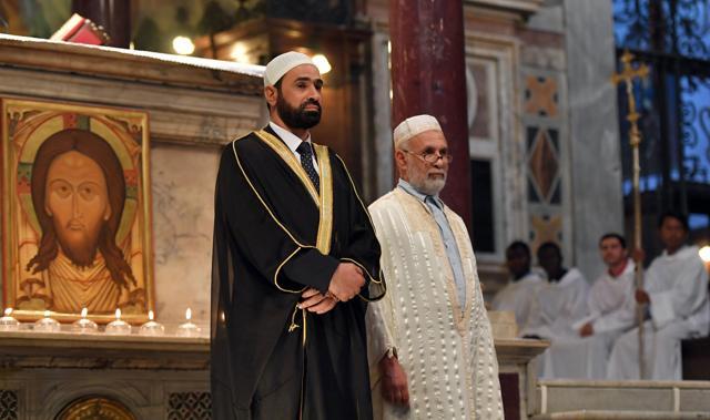 Iman Sami Salem (L) and Imam Mohammed ben Mohammed (R) stand during a mass in the Church Santa Maria in Trastevere in Rome on Sunday. (AFP) Iman Sami Salem (L) and Imam Mohammed ben Mohammed (R) stand during a mass in the Church Santa Maria in Trastevere in Rome on Sunday. (AFP)