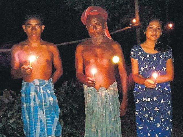 This year, as the midnight bell rang on July 31, hundreds of former enclave dwellers lit up oil lamps inside their homes and on the roads to protest administrative negligence. (HT Photo) This year, as the midnight bell rang on July 31, hundreds of former enclave dwellers lit up oil lamps inside their homes and on the roads to protest administrative negligence. (HT Photo)