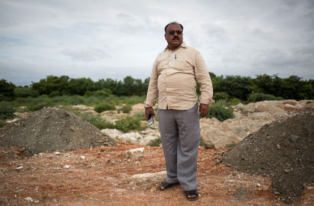 V Gangi Reddy, president of non-profit Rural Reconstruction and Development society, at a mineral dumping ground near Ananthamadugu village in Sydapuram. (Vivek Muthuramalingam, Thomson Reuters Foundation)