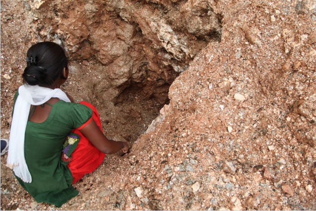 Sixteen-year-old Vinita goes into a rat-hole mine to search for mica in Giridih district of Jharkhand on June 27, 2016. (Nita Bhalla, Thomson Reuters Foundation)