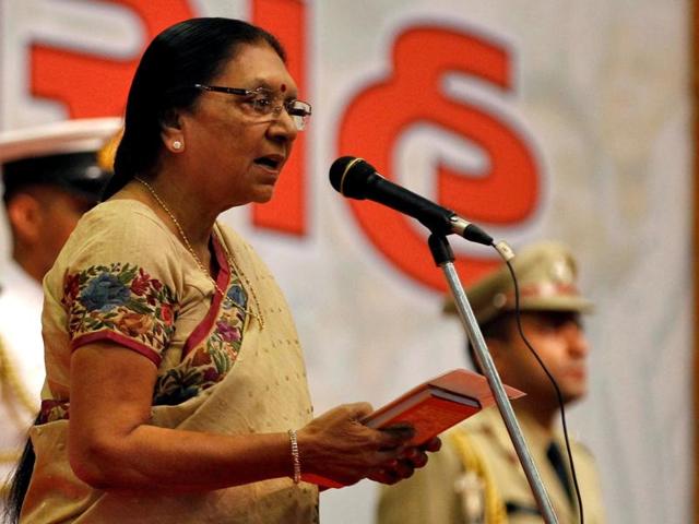 Anandiben Patel takes as the Gujarat chief minister during a swearing-in ceremony at Gandhinagar in Gujarat.(REUTERS File)