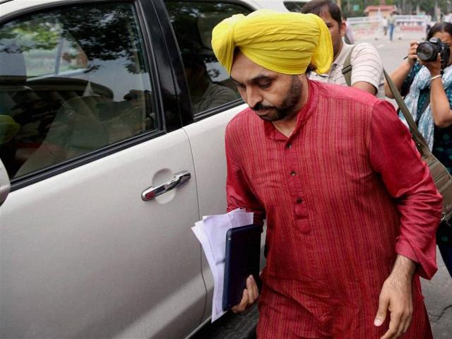 Aam Aadmi Party MP Bhagwant Mann arrives to appear before a Lok Sabha panel regarding a row over live streaming a video on Facebook, at Parliament in New Delhi.(PTI File Photo)