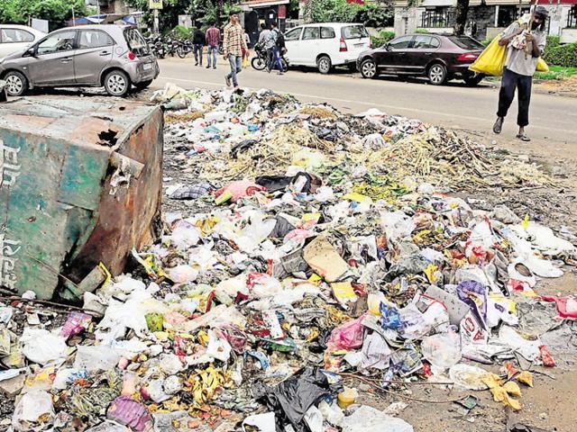 A ragpicker passes by a heap of garbage in Jaipur’s Lal Kothi area on Tuesday. (HT Photo) A ragpicker passes by a heap of garbage in Jaipur’s Lal Kothi area on Tuesday. (HT Photo)
