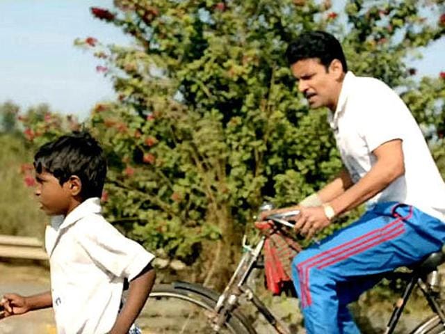 Manoj Bajpayee plays Budhia Singh’s coach in the film. (YouTube) Manoj Bajpayee plays Budhia Singh’s coach in the film. (YouTube)