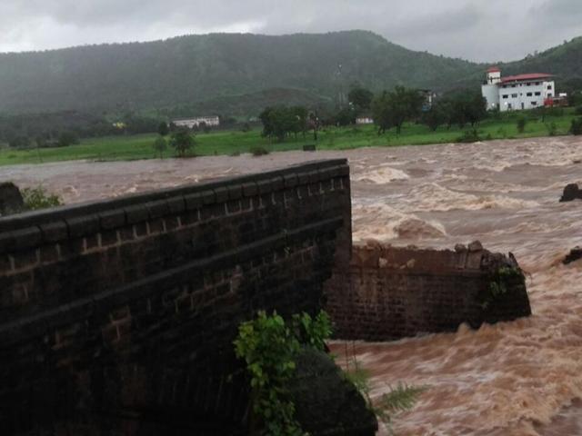 The bridge, built more than seven decades ago during the British rule, gave way around midnight due to the heavy rains which flooded the river. (HT Photo)
