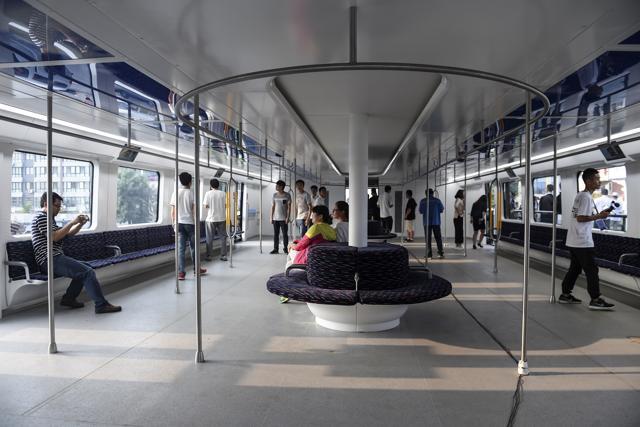 The inside of the Transit Elevated Bus (TEB). The straddle bus is 72-feet-long and 25-feet-wide, and is powered by electricity. It is designed to go over the normal traffic and help ease congestion without having to dig new tunnels or build elevated rail tracks. (AP Photo) The inside of the Transit Elevated Bus (TEB). The straddle bus is 72-feet-long and 25-feet-wide, and is powered by electricity. It is designed to go over the normal traffic and help ease congestion without having to dig new tunnels or build elevated rail tracks. (AP Photo)