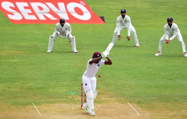 Darren Bravo watches the ball pass off a delivery from India's Ishant Sharma on day four of their Second Test cricket match on Tuesday. (AFP)