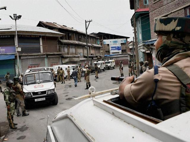 Securitymen patrol a street during curfew in Srinagar on Tuesday. (PTI) Securitymen patrol a street during curfew in Srinagar on Tuesday. (PTI)