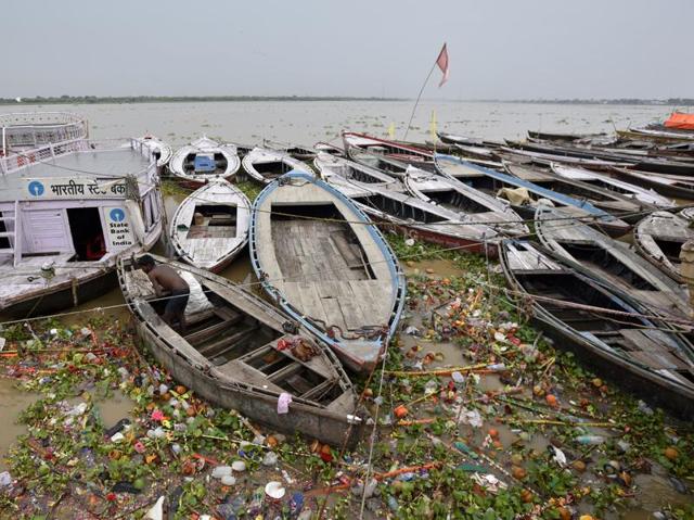 Garbage and hyacinth plants float in the Ganges near Dashashwamedh Ghat where unused boats add to the concern in Varanasi. Municipal figures show that the streams are now highly polluted as about 30 metric tons of the city’s daily waste entering them. (Ravi Choudhary/HT PHOTO)