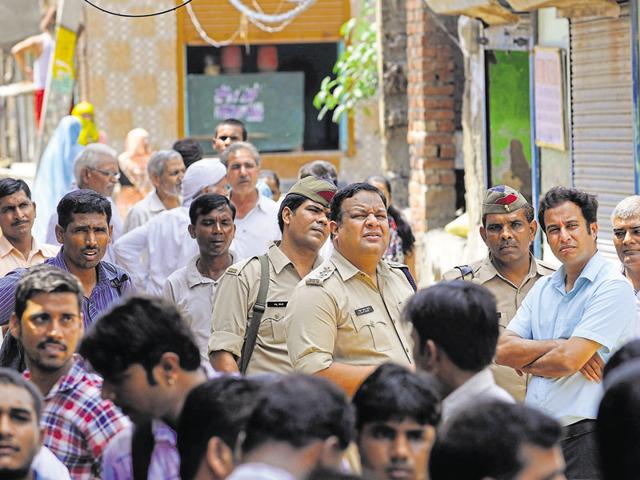 Public near the victim’s house. Experts say the family can move court against the people and politicians who are visiting their house.(Sunil Ghosh/HT Photo) Public near the victim’s house. Experts say the family can move court against the people and politicians who are visiting their house.(Sunil Ghosh/HT Photo)