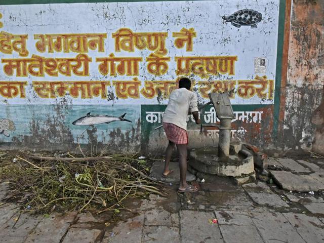 A message written on a wall at Rajghat in Varanasi calls for action against polluting River Ganga. The NDA government’s ‘Ganga rejuvenation plan’ is aimed at cleaning Ganga and restoring it’s past glory. (Ravi Choudhary/HT PHOTO)