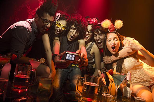 Friends get together for a party with beer. (ImagesBazaar)