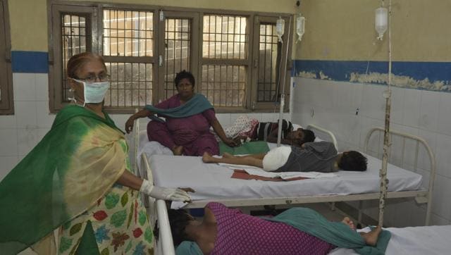Inmates of Sukhjit Ashram at a hospital on Wednesday after they fell ill upon eating some food at the shelter for the mentally challenged on Tuesday. (HT Photo)
