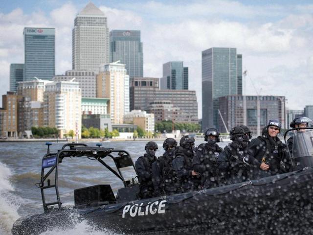 Armed Metropolitan Police counter terrorism officers take part in an exercise on the River Thames in London. London's police force is putting more armed officers on the streets “to protect against the threat of terrorism”. (AP Photo)