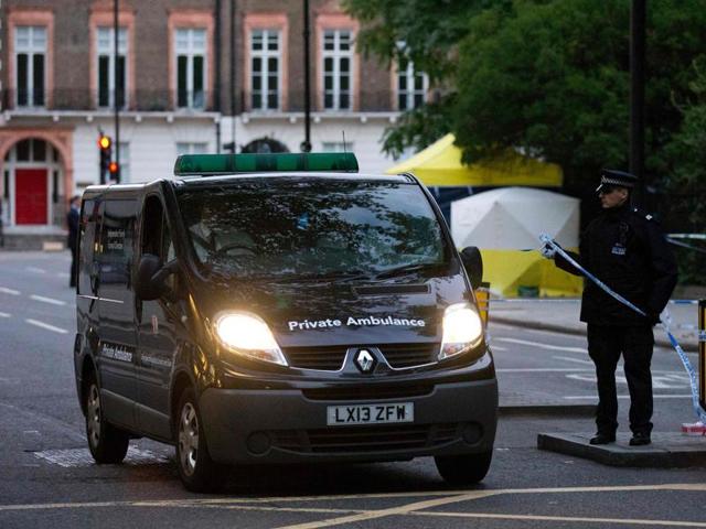 A private ambulance leaves Russell Square in London after a woman who was in her 60s was killed during a knife attack. (AFP Photo)