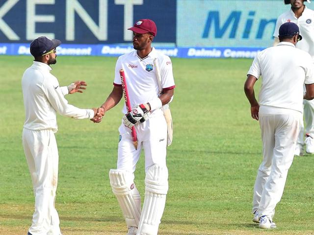 India skipper Virat Kohli shakes hands with West Indies centurion Roston Chase after the rain-hit second Test in Jamaica ended in a draw on Wednesday. (AFP Photo) India skipper Virat Kohli shakes hands with West Indies centurion Roston Chase after the rain-hit second Test in Jamaica ended in a draw on Wednesday. (AFP Photo)