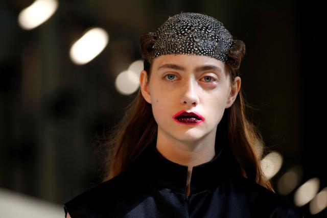 A model presents a creation by British designer John Galliano as part of his Haute Couture Fall/Winter 2016/2017 collection for Maison Margiela fashion house in Paris, France. The neon-lined dark lip created a multi-dimensional vibe to the look. (Reuters/Benoit Tessier) A model presents a creation by British designer John Galliano as part of his Haute Couture Fall/Winter 2016/2017 collection for Maison Margiela fashion house in Paris, France. The neon-lined dark lip created a multi-dimensional vibe to the look. (Reuters/Benoit Tessier)