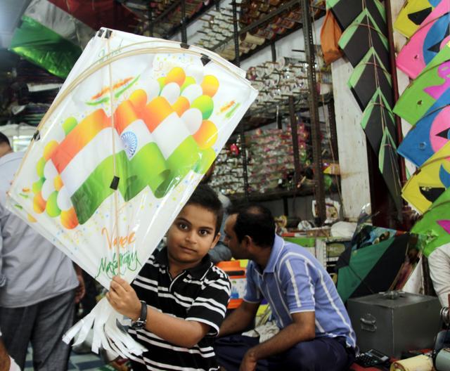 Krrish Luthra, 10, came all the way from Rohini to buy kites in bulk. (Shivam Saxena/HT)