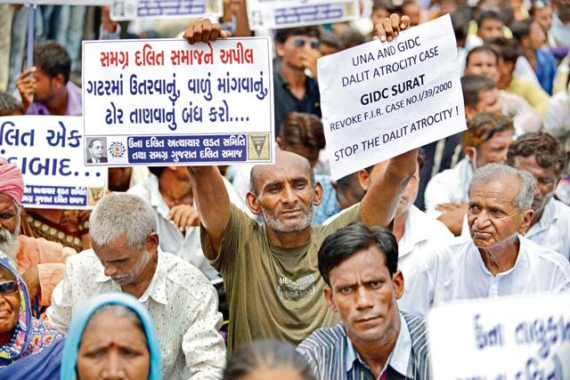 Dalits attend a protest rally against the Una attack, in Ahmedabad, Gujarat. (AFP Photo) Dalits attend a protest rally against the Una attack, in Ahmedabad, Gujarat. (AFP Photo)