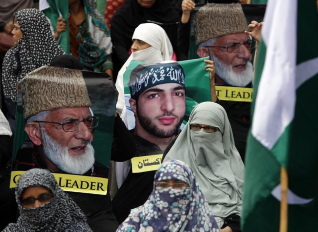 Women supporters of Pakistani religious party Jamaat-e-Islami attend an anti-Indian rally holding pictures of Burhan Wani in Karachi. (AP) Women supporters of Pakistani religious party Jamaat-e-Islami attend an anti-Indian rally holding pictures of Burhan Wani in Karachi. (AP)