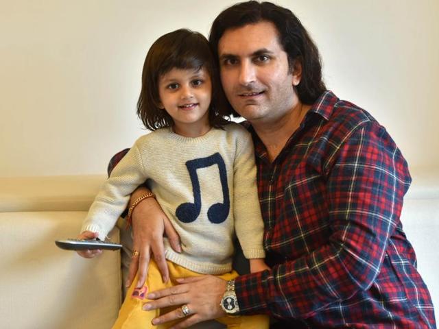 Rahul Sharma with his two-year-old son, Abhinav, at his Pali hill residence (Photo: Vidya Subramanian/HT) 