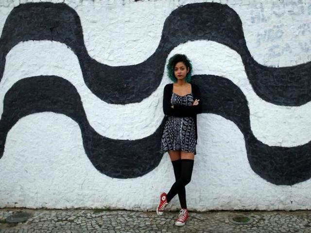 Aline Santos, a 23-year-old student, poses for a portrait in Rio de Janeiro.