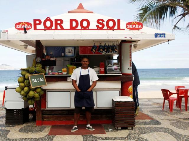 Dayvison Nascimento, a 25-years-old bartender, poses for a portrait at the Ipanema beach in Rio de Janeiro. (REUTERS)