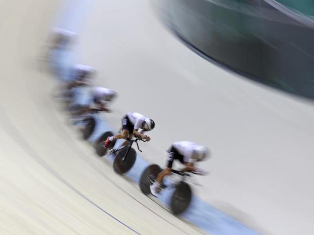 Members of the German men's track cycling team round the track during a training session inside the Rio Olympic Velodrome on Tuesday. (AP Photo) (AP)